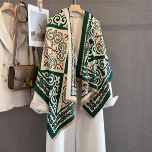 Detailed close-up of vintage geometric jacquard pattern on scarf with fringe tassels