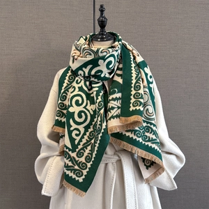Close-up of vintage geometric pattern thick scarf with fringe tassels on mannequin