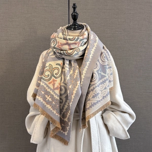 Vintage geometric jacquard scarf with ethnic patterns and fringe on a mannequin