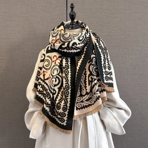 Close-up of vintage geometric jacquard pattern and fringe edge on winter shawl