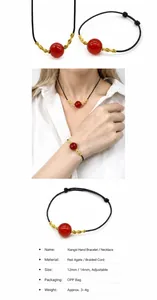 Macro detail of hand-woven red agate bead necklace with adjustable cord and gold accents