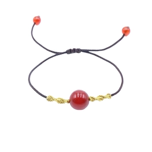 Minimalist red agate bead braided bracelet with adjustable cord and golden spiral accents