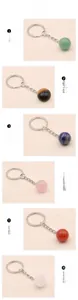 Vertical view of six natural crystal ball keychains including tiger eye and rose quartz