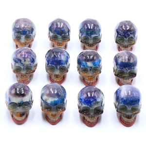 Set of 12 carved natural stone skulls with multi-color layering for Halloween decor