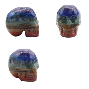Hand-carved Seven Chakra natural stone skull figurine shown from multiple angles