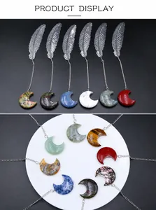 Detail of silver feather bookmarks with crescent moon natural stone pendants in various colors
