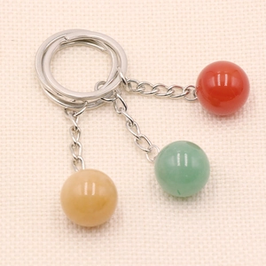 Three natural crystal ball keychains in tiger eye and rose quartz for bags