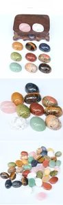 Macro detail of hand-carved natural crystal beetle beads with horizontal drilled holes
