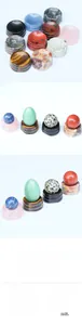 Detailed display of natural crystal sphere bases in tiger eye, quartz, and agate materials