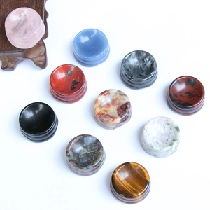 Assorted natural crystal sphere stands in rose quartz and lapis for stone ball display