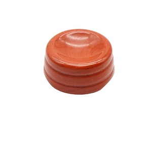 Red agate crystal ball base with polished stone texture and decorative ring grooves