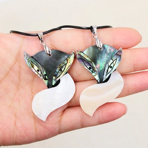 Abalone shell fox pendant necklace featuring iridescent mosaic shells on a black cord