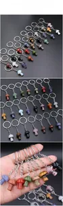 Detailed view of mushroom-shaped natural stone keychains in various colorful gemstones