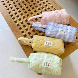 Quilted pastel candy color handbags with tulip labels in pink, blue, yellow and green