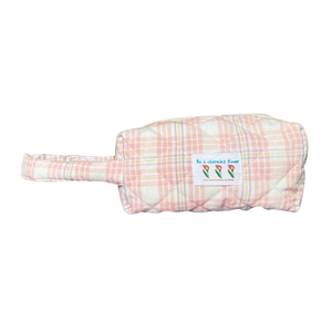 Pink quilted candy color handbag with floral label and stylish checkered pattern design