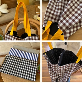 Détail du grand sac cabas en toile rayée avec anses jaunes et doublure intérieure noire
