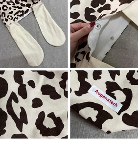 Close-up of leopard print canvas tote bag with rabbit ears and metal snap button