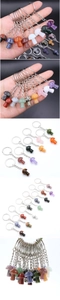 Detailed view of polished crystal mushroom keychains in various colorful gemstones