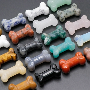 Various 35mm natural crystal and agate bone-shaped stones with polished smooth finish