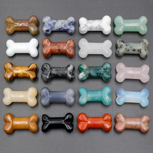 Polished 35mm natural crystal bone carvings in diverse gemstones like tiger eye and quartz