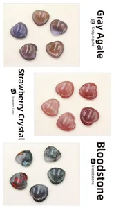 Polished heart-shaped gray agate, strawberry crystal, and bloodstone worry stones