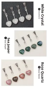 Detail of Cupid heart pendants in white crystal, sea jasper, and rose stone textures