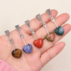 Five assorted natural crystal heart pendants with Cupid's arrow in various gemstones