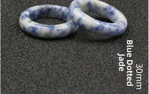 Detailed macro shot of 30mm natural Blue Spot Jasper stone ring with polished texture