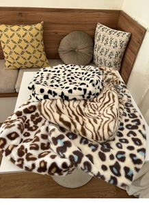 Close-up of fluffy tote bags in animal prints including cow, zebra, and leopard patterns