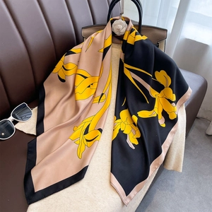 Elegant 90cm square silk-feel scarf with yellow lily pattern on black and beige background