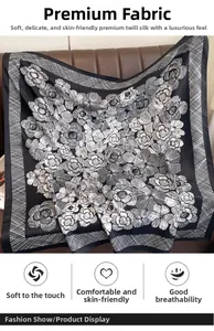 Close-up of premium silk-like twill scarf featuring elegant white camellia floral patterns