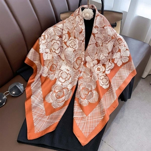 Orange and white floral silk scarf with camellia print and geometric patterns
