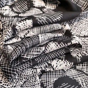 Floral print twill silk square scarf for women featuring monochrome geometric patterns