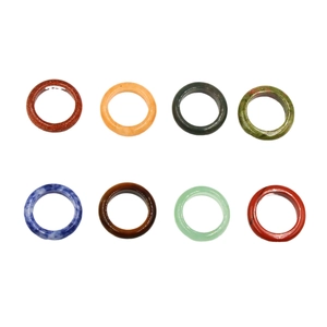 Polished natural stone ring set featuring tiger eye, agate, and various gemstones
