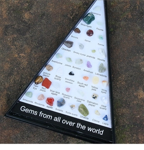 Triangle collection box showing 36 types of natural gemstone and mineral ore specimens