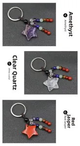 Detailed view of star-shaped natural Amethyst, White Crystal, and Red Jasper keychains