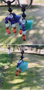 Detail of star-shaped natural stone keychains with seven chakra bead charms and metal ring
