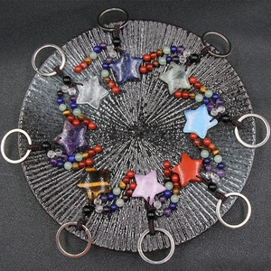 Set of seven star-shaped natural crystal keychains in various gemstones and silver rings
