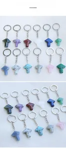 Macro shot of twelve different natural crystal mushroom keychains in a colorful set