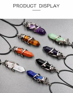Detail showing various hexagonal natural crystal stone pendants with rose flower metal wrap