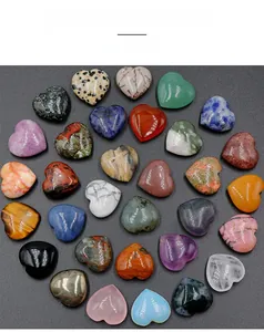Flat lay of colorful 30mm polished heart-shaped natural crystal and agate stones