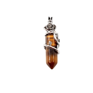 Tiger eye crystal hexagonal pendant with silver rose vine wrap on white background