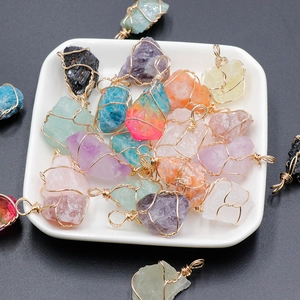 Handmade wire wrapped natural crystal pendants in amethyst pink quartz and more