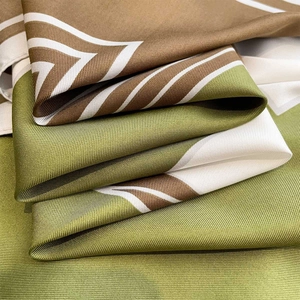 Macro shot of 90cm square silk scarf showing high-quality twill weave and satin texture