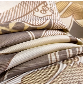 Close-up of luxury floral and geometric pattern silk scarf with soft twill texture