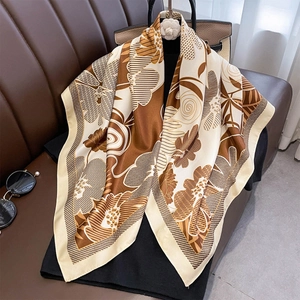 Elegant floral silk-like square scarf in beige and brown with artistic geometric print