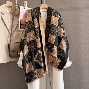 Retro vintage cashmere-style plaid jacquard scarf with tassels on white wool coat