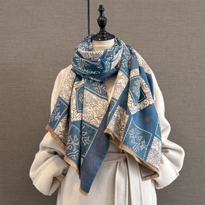 Detail of vintage navy plaid scarf with auspicious cloud patterns and tassel fringe