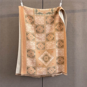 Detail of vintage plaid jacquard scarf with intricate tassel fringe and fabric texture