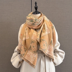 Close-up of retro geometric jacquard scarf with fine fringe detail and thick texture
